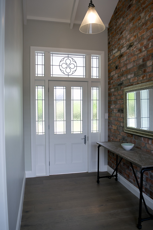 entrance, hallway, neutrals, feature wall, front door