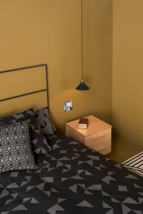 bedroom, yellow bedroom, gold bedroom, citta design, black and yellow, mustard bedroom