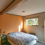 bedroom inspiration, bedroom ideas, peach interior, terracotta interior, orange feature wall, resene