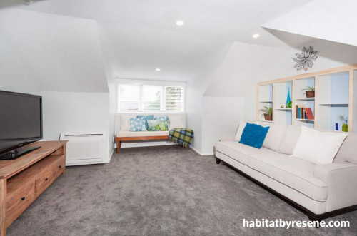 white living area, white lounge, white paint, custom shelving, blue paint 