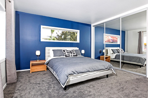 blue bedroom, feature wall, master bedroom, grey and blue, grey carpet, blue paint
