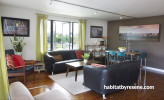 living room, lounge, brown dining room, feature wall, brown paint, white paint 