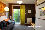 living room, lounge, brown paint, white living room, feature wall, retro lounge
