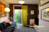 living room, lounge, brown paint, white living room, feature wall, retro lounge