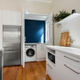White kitchen blue laundry
