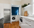 White kitchen blue laundry