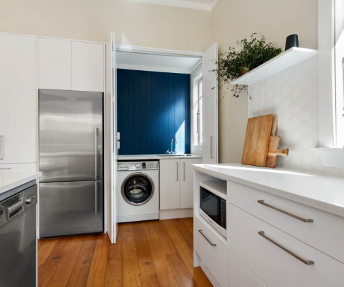 White kitchen blue laundry