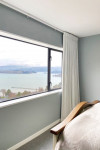 This Governors Bay home uses a clever colour trick to link two storeys together and fill the home with warm light (that’s not too bright)