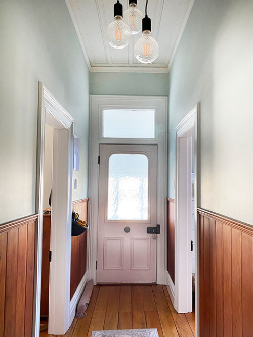 pastel hallway pink door